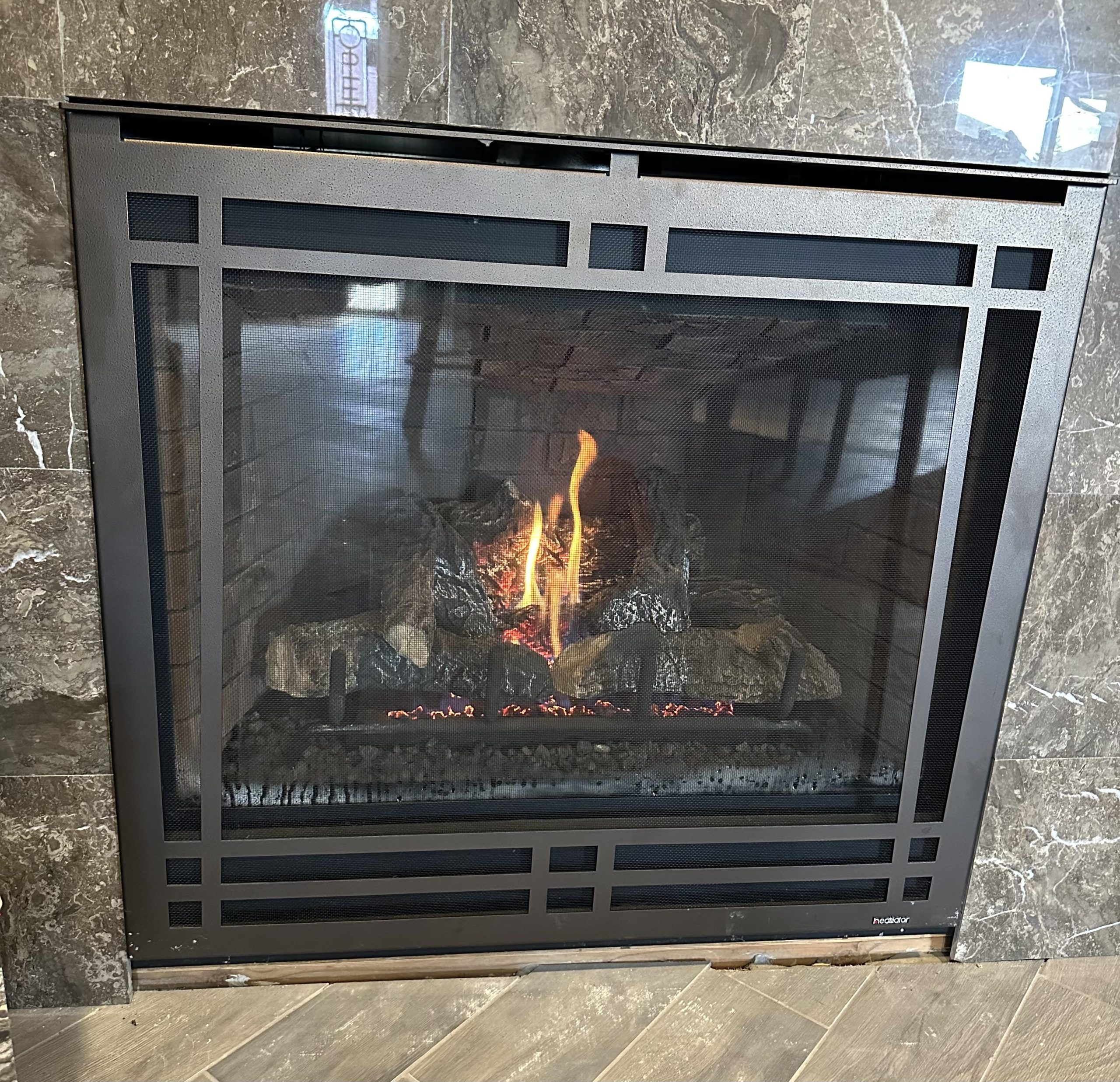 What is the difference between gas logs and a gas insert? ACE
